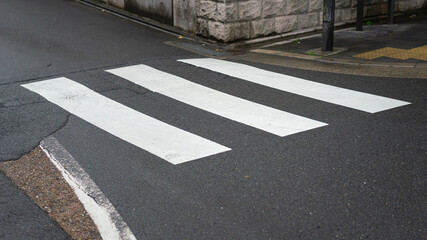 Zebra crossing line on the asphalt road, area for pedestrian crossing road safely. Transportation...