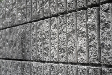 Stone wall structure with roughly surface, construction material. Background and texture photo.