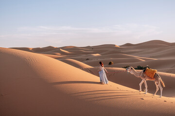 Amidst vast dunes and the majestic Atlas Mountains, experience a sunset camel trek, embrace Berber...