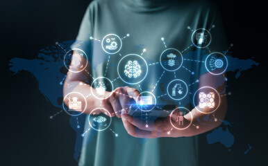 Smart industry concept. Automation and data exchange in smart manufacturing technologies.  Industry 4.0, connected robots with internet of things (IoT) with cloud computing. Businessman press button.