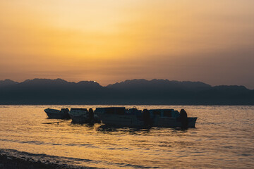 Fishing boat floating in the sea Egypt at sunrise
