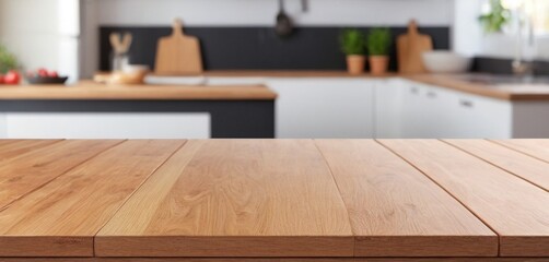 Wooden table on blurred kitchen bench background. Empty wooden table and blurred kitchen background for display or montage your products