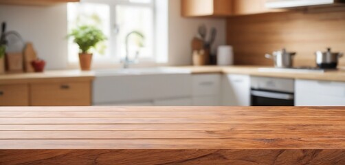 Wooden table on blurred kitchen bench background. Empty wooden table and blurred kitchen background for display or montage your products