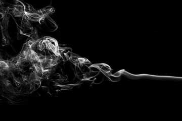 Incense sticks smoke on black background, black and white monochromatic studio picture. Abstract...