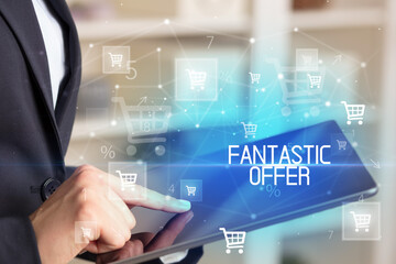 Young person makes a purchase through a tablet