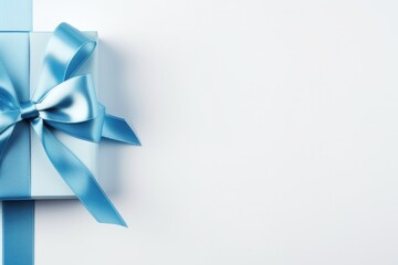 Top View of Blue Holiday Bow on White Background - Ideal for Gift Packages, Holiday Notes, and More