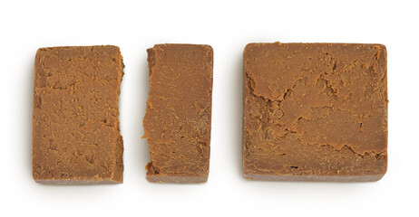 Brown cheese. Norwegian brunost isolated on white background. Top view. Flat lay