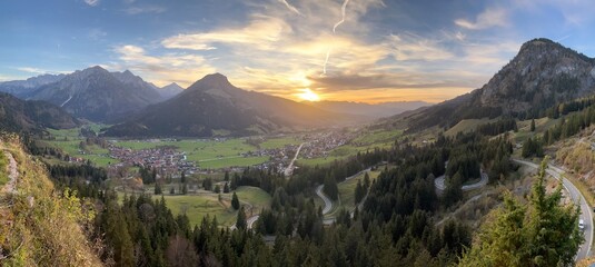 Stunning sunset view of the Bavarian Alps in southern Germany with beautiful mountains and quaint...