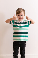 Portrait of a happy little boy on a white background