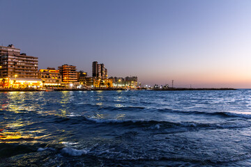 Scenic night view of sea promenade in city of Tripoli and the Mediterranean Sea. Republic of Lebanon
