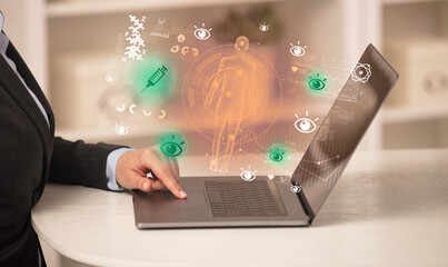 Doctor working on laptop with healthcare concept