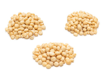 Macadamia nuts isolated on white background.
