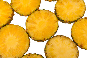 Pineapple juicy yellow slices on a white background.