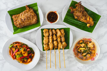 Many types of delicious food made from crocodile meat. Grilled crocodile steak with Thai spicy dipping sauce or Jaew sauce,Hot spicy crocodiles soup,Spicy stir fried crocodile,Grilled crocodile steak.