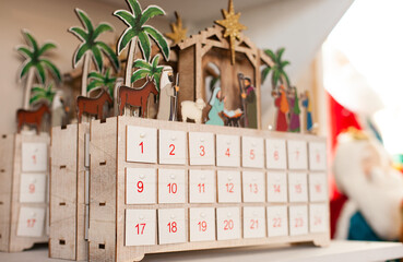 christmas or three kings day advent calendar with religion scene with baby and palm trees
