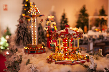 christmas carousel with lights mechanic toy at xmas market shelf for gift shopping