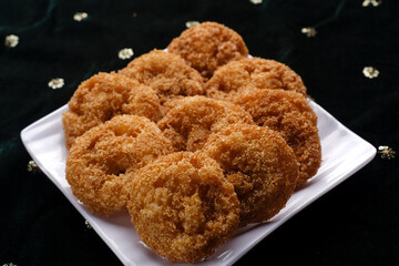 Anarsa which is an authentic sweet snack especially made in the festive season like Diwali in Maharashtra, it is also made in Marathi cultured adhik maas, selective focus.