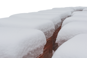 Construction facing bricks on a pallet, powdered with thick snow