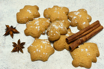 gingerbread biscuits in shape of star, fir and gingerbread man  