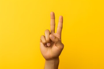 Naklejka premium a person making a peace sign with their fingers Generative AI