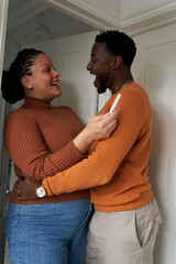 Fototapeta premium Happy couple celebrating their pregnancy test results. Concept of family, pregnancy, diverse, motherhood