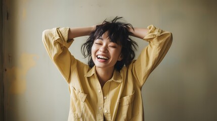 a woman in a yellow shirt smiling with her hands on her head Generative AI