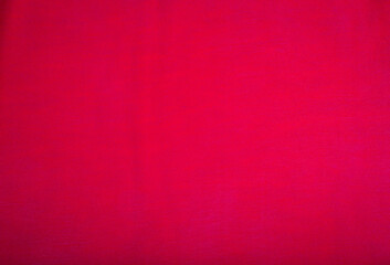 Pink fabric used for sewing clothes for store. Textile material polyester,knitted or cotton fabric texture as background. Catalog photo of samples. 