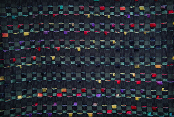 Multicolored fabric used for sewing clothes for store. Textile material texture as background. Catalog photo of samples. 