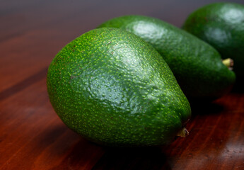 Green ripe avocado fruits from organic avocado plantation - healthy food