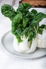 Young organic white bok choy or bak choi Chinese cabbage ready to cook