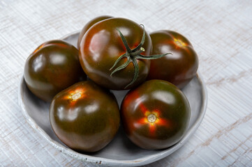 Fresh ripe sweet reddish brown and green kumato tomatoes