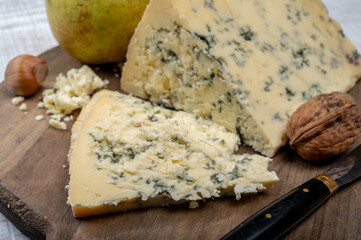Cheese collection, English semi-soft, crumbly old stilton blue cheese close up