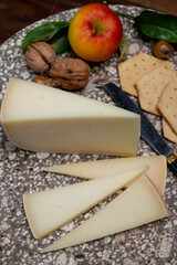 Piece of tasty Ossau-Iraty or Esquirrou sheep cheese produced in south-western France, Northern Basque Country