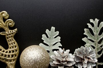 New Year's silver decorations on a black background with space for text