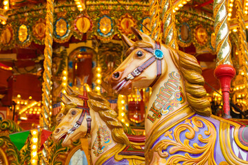 Vintage carousel. Carousel horse. Merry-Go-Round. Galloping horses.
