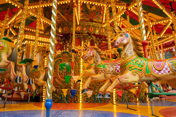 Fototapeta na wymiar Vintage carousel. Carousel horse. Merry-Go-Round. Galloping horses.