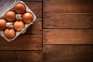 Egg box on a rustic wooden board
