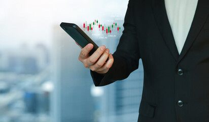 close up young investor man hand hold smartphone to trade on stock market on exchange platform...