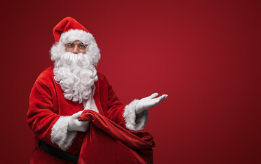 Santa Claus making a time out gesture, pausing the festive hustle