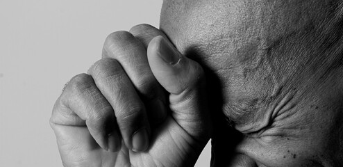 man praying to god on gray background with people stock image stock photo	
