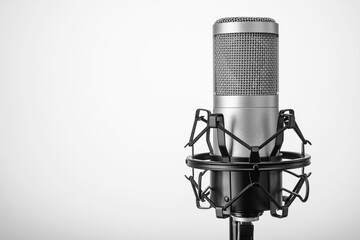 Silver microphone on the gray background. Copy space.