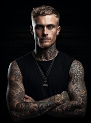 The Inked Rebel: A Man with Intricate Tattoos and a Bold Black Shirt