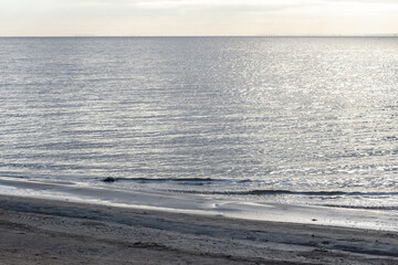 Baltic Sea coastal view, blue water is near an empty coast on a daytime
