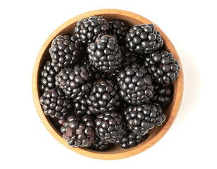 wooden Bowl of blackberries isolated on white background; Cutout
