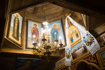 wooden church with Orthodox icons and Ukrainian embroidered towels