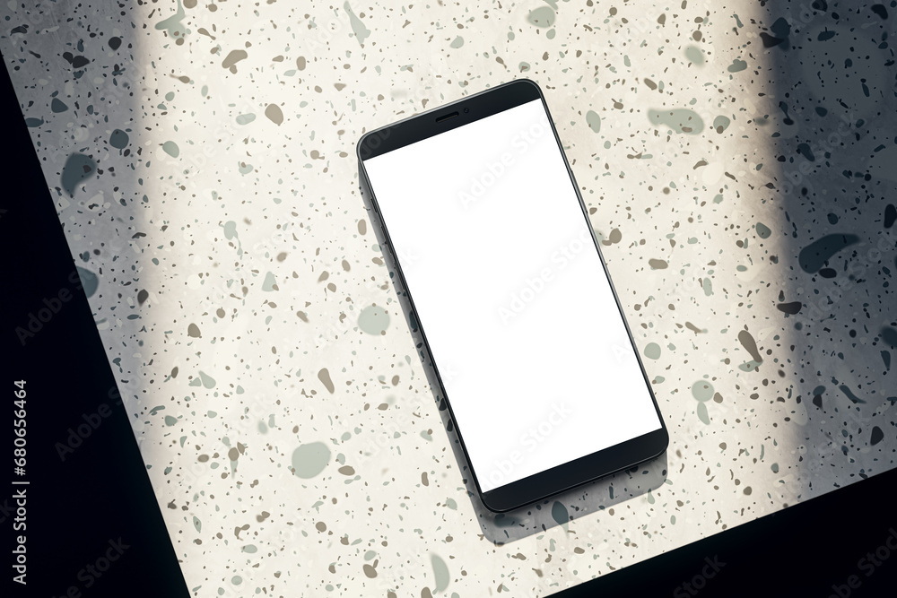 Leinwandbilder top view of empty white smartphone on spotted table. mock up, 3d rendering.