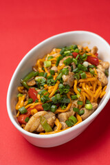Asian cuisine. Noodles with chicken. Close up