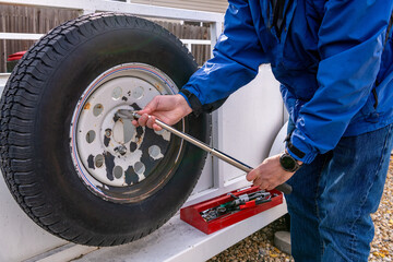 Spare tire removal from a utility trailer