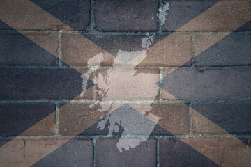 map and flag of scotland on a old brick wall