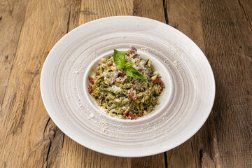 Italian cuisine. Pasta with meat and parmesan cheese. Close up